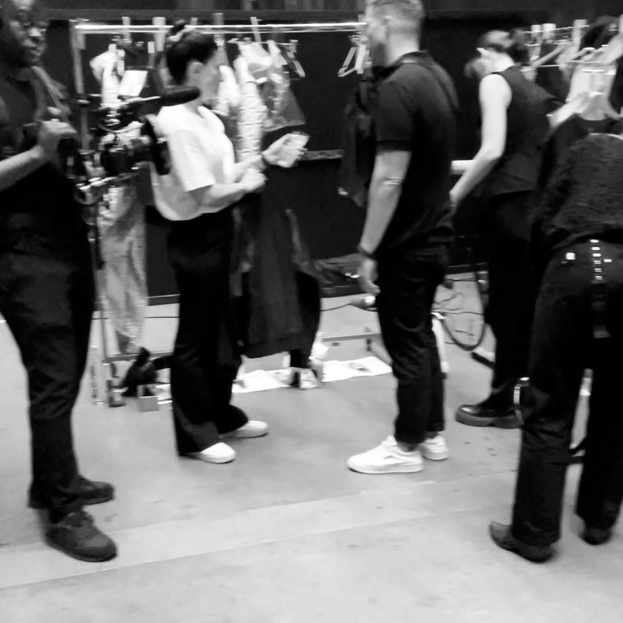 Videographer filming backstage at a fashion show